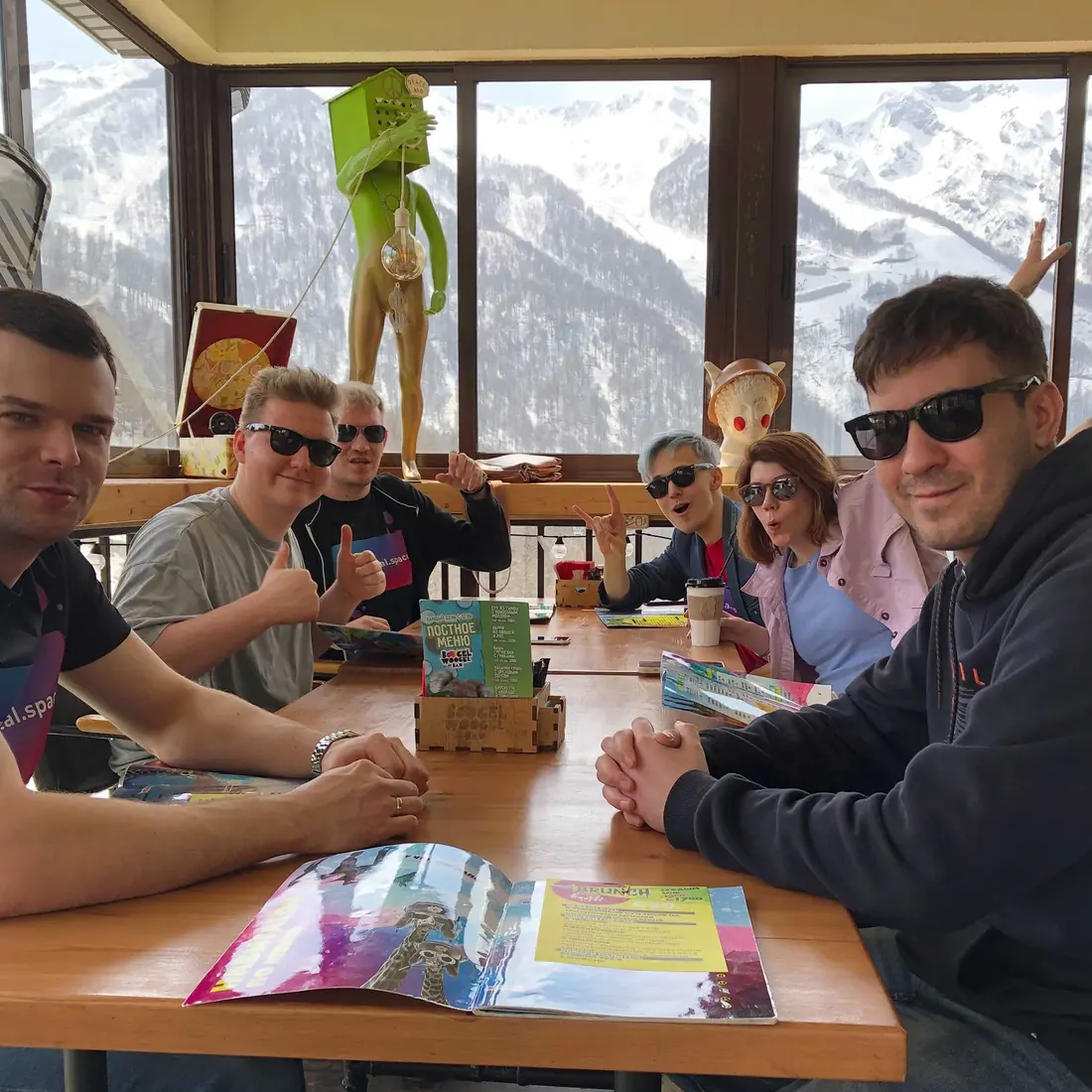 VL team in sunglasses at a mountain café